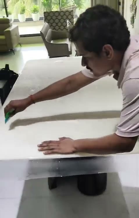 Marble table top being coated